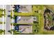 Aerial view highlights a home with well-manicured lawn and fenced in patio with roof, surrounded by neighbors at 5236 Wishing Arch Dr, Apollo Beach, FL 33572