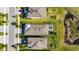 A birds eye view showcases the manicured backyard, fenced patio with roof and neat lawn, surrounded by neighboring houses at 5236 Wishing Arch Dr, Apollo Beach, FL 33572