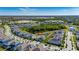 A diverse residential area is pictured, featuring an array of homes, lush green spaces, and peaceful water features at 5236 Wishing Arch Dr, Apollo Beach, FL 33572