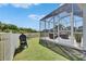 Outdoor living area with a view of landscaping, pond and neighborhood homes at 5236 Wishing Arch Dr, Apollo Beach, FL 33572