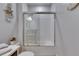 Bright bathroom with a shower and tub combo featuring coastal decor at 5236 Wishing Arch Dr, Apollo Beach, FL 33572