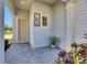 Charming front porch featuring neutral colors, decorative accents, and a welcoming entrance at 5236 Wishing Arch Dr, Apollo Beach, FL 33572