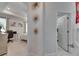 Hallway view towards a bedroom, showcasing stylish decor and modern lighting at 5236 Wishing Arch Dr, Apollo Beach, FL 33572