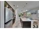 Bright kitchen showcases modern appliances, a central island with seating, and a seamless layout at 5236 Wishing Arch Dr, Apollo Beach, FL 33572