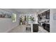 Modern kitchen with stainless steel appliances, island seating and an open floor plan at 5236 Wishing Arch Dr, Apollo Beach, FL 33572