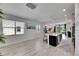 Bright living space with an open floor plan, island seating and modern decor at 5236 Wishing Arch Dr, Apollo Beach, FL 33572