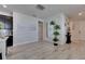 Open-concept living space featuring a stylish chandelier, ceramic floors, and modern decor at 5236 Wishing Arch Dr, Apollo Beach, FL 33572
