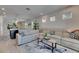 Inviting living room with comfortable seating and view to the kitchen at 5236 Wishing Arch Dr, Apollo Beach, FL 33572