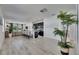 Open-concept living area flows into a modern kitchen with an island, perfect for entertaining guests at 5236 Wishing Arch Dr, Apollo Beach, FL 33572