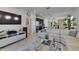 Open concept living room with large sectional couch and kitchen views at 5236 Wishing Arch Dr, Apollo Beach, FL 33572