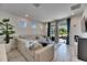 Comfortable living room with large windows and a view of the outdoor patio at 5236 Wishing Arch Dr, Apollo Beach, FL 33572