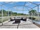 Covered patio with comfortable seating, perfect for relaxing and enjoying the outdoor view at 5236 Wishing Arch Dr, Apollo Beach, FL 33572