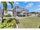 An expansive screened patio with ample seating, perfect for relaxing and entertaining in comfort at 5236 Wishing Arch Dr, Apollo Beach, FL 33572
