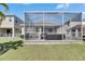 A screened patio area with comfortable seating, ideal for enjoying the outdoors bug-free at 5236 Wishing Arch Dr, Apollo Beach, FL 33572