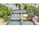 Aerial view of well-maintained tennis courts surrounded by lush greenery in a planned community at 5236 Wishing Arch Dr, Apollo Beach, FL 33572