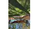 Green backyard featuring lots of grass, shade and a wooden pergola at 5340 4Th S Ave, St Petersburg, FL 33707