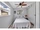 Comfortable bedroom with ceiling fan, natural light, and hardwood floors at 5340 4Th S Ave, St Petersburg, FL 33707