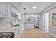 Bright kitchen featuring white cabinets, quartz countertops and tile flooring at 5340 4Th S Ave, St Petersburg, FL 33707