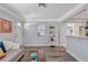 Living room with hardwood floors, a grey couch and lots of natural light at 5340 4Th S Ave, St Petersburg, FL 33707