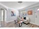 Living room with hardwood floors, grey couch and white door at 5340 4Th S Ave, St Petersburg, FL 33707