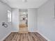 Bright, airy room with wood flooring and a view of the kitchen area at 5340 4Th S Ave, St Petersburg, FL 33707