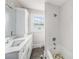 Updated bathroom featuring a tiled shower and tub with quartz countertops at 5426 Venetian Ne Blvd, St Petersburg, FL 33703