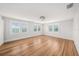 Spacious bedroom features hardwood flooring and three windows with blinds at 5426 Venetian Ne Blvd, St Petersburg, FL 33703