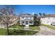 Beautiful two-story home with well-maintained lawn and a charming water fountain at 5426 Venetian Ne Blvd, St Petersburg, FL 33703