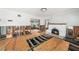 Open living room featuring a fireplace, large windows, and floors currently under construction at 5426 Venetian Ne Blvd, St Petersburg, FL 33703