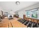 Spacious living room features a cozy fireplace, large windows, and under-construction floors at 5426 Venetian Ne Blvd, St Petersburg, FL 33703