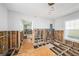 Bright, airy room in mid-renovation featuring new framing and abundant natural light from large windows at 5426 Venetian Ne Blvd, St Petersburg, FL 33703