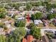An aerial shot of the property showcases its neighborhood and the surrounding wooded area at 5507 Bluejay Ln, Tampa, FL 33625