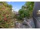 Backyard oasis featuring lush landscaping, a tranquil pond, and a charming water feature, perfect for relaxation at 5507 Bluejay Ln, Tampa, FL 33625