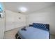 Bedroom with closet, door, television, and bright natural light at 5507 Bluejay Ln, Tampa, FL 33625