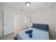 Bright bedroom features tile flooring, a door to the backyard and closet space at 5507 Bluejay Ln, Tampa, FL 33625