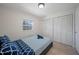 Cozy bedroom with closet space and a window for natural light at 5507 Bluejay Ln, Tampa, FL 33625