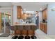 Well-appointed kitchen featuring a breakfast bar, stainless steel appliances, and granite countertops at 5507 Bluejay Ln, Tampa, FL 33625