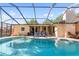 Screened-in pool features a lounging area with chairs and a well-maintained deck for relaxing and entertaining at 5507 Bluejay Ln, Tampa, FL 33625