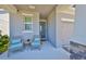 Cozy front porch with comfortable seating, offering a relaxing outdoor space to enjoy at 5523 Del Coronado Dr, Apollo Beach, FL 33572