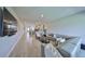 Open-concept living room features neutral decor and modern furnishings, seamlessly flowing into the kitchen at 5523 Del Coronado Dr, Apollo Beach, FL 33572