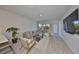 Stylish living room with modern furniture, hardwood floors, and large windows, creating an inviting atmosphere at 5523 Del Coronado Dr, Apollo Beach, FL 33572