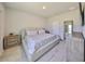 Bedroom with a king bed, neutral color scheme, a dresser and plank flooring at 5523 Del Coronado Dr, Apollo Beach, FL 33572
