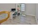 Home office with wood floors, a stylish mirror, and natural light, perfect for remote work at 5523 Del Coronado Dr, Apollo Beach, FL 33572