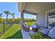 Cozy outdoor patio with comfortable seating, ideal for enjoying the manicured backyard at 5523 Del Coronado Dr, Apollo Beach, FL 33572