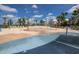 Community splash pad with various water features under a sunny sky, surrounded by palm trees at 5523 Del Coronado Dr, Apollo Beach, FL 33572