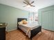 Inviting bedroom with a ceiling fan, natural light, and a cozy ambiance at 6103 Saint Remy Way, Lutz, FL 33558