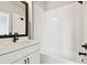 Bright bathroom featuring a subway tiled shower/tub combo and modern vanity at 6605 N Nebraska Ave # 30, Tampa, FL 33604