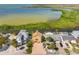 Multi-story home with balconies, surrounded by lush greenery and waterfront access at 6633 Driftwood Dr, Hudson, FL 34667