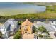 Charming multi-story home with balconies, surrounded by lush greenery and waterfront access at 6633 Driftwood Dr, Hudson, FL 34667