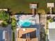 Backyard view featuring a private pool, lush landscaping, and deck overlooking the water at 6633 Driftwood Dr, Hudson, FL 34667